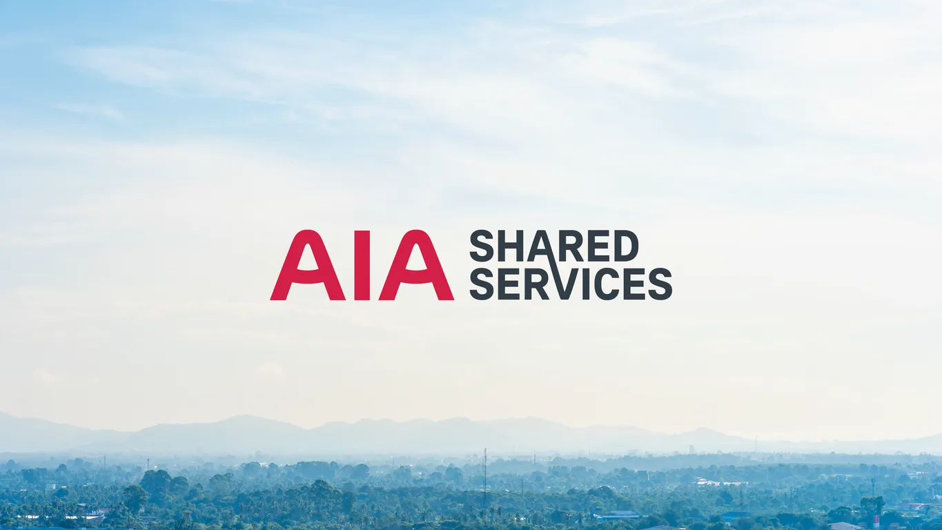 AIA Shared Services logo in red and charcoal set over a misty hillside landscape